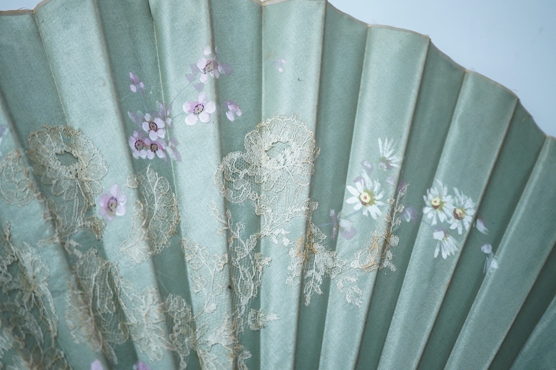 A collection of 19th century and later fans to include a black lacquered and lace example and a hand painted floral example